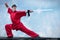 Wushoo man in red practice martial art