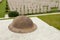 WW1 British Cemetery headstones with helmet in foreground.