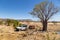 Wyndham, WA, Australia - Aug 31, 2014: A Toyota Landcruiser and Camprite offroad camper trailer park next to an isolated boab tree