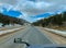 Wyoming Highway road in mountains covered with snow