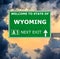 WYOMING road sign against clear blue sky