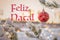 "Feliz Natal" means "Merry Christmas" in Portuguese. 25 December. Blurred background of Christmas tree in snow