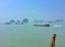 "Koh Tapoo, Ao Phang Nga" on island in Thailand. Many boat at sea and rock background.