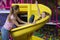 It& x27;s playtime. Loving young mother and her daughter having fun together, riding slide at indoor amusement park