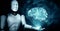 XAI AI hominoid robot holding virtual hologram screen showing concept of AI brain
