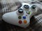 Xbox controller white color joystick lies on soft fabric