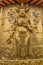 XIAHE, CHINA - AUGUST 25, 2018: Golden Buddha relief at Gongtang pagoda at Labrang monastery in Xiahe town, Gansu