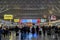 Xian, China - December 29, 2019: Passengers at Xian Station high speed train station terminal with electronic time table and led
