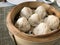 Xiao Long Bao Steamed Soup Dumplings placed in a steamer. Type of Chinese steamed bun filled with meat and soup inside. ready to