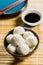 Xiaolongbao, traditional steamed dumplings and soy sauce. Xiao Long Bao buns in bowl