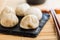 Xiaolongbao, traditional steamed dumplings. Xiao Long Bao buns on cutting board