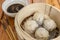 Xiaolongbao, a type of small Chinese steamed bun oe baozi traditionally prepared in a xiaolong, a small bamboo steaming basket