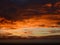 Xilinhot - Colofrul sunrise seen from a small hill in the suburbs of Xilinhot, Inner Mongolia. The sky is painted in orange,