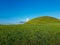 Xilinhot - A panoramic view on a hilly landscape of Xilinhot in Inner Mongolia. Endless grassland with a few wildflowers between