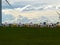 Xilinhot - Yellow and white traditional yurts located on a pasture in Xilinhot in Inner Mongolia. Endless grassland. Blue sky