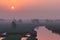 XINGHUA, CHINA: Canal in rapeseed field at morning