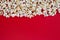 Xmas Christmas holiday concept. Top above high angle overhead closeup view photo of tasty delicious yummy popcorn with copy space