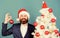 xmas forever. bearded man santa hat hold xmas ball. magic creativity. white christmas. businessman decorate new year