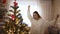 xmas and happy new year at home athmosphere concept. 4k slow motion joyful attractive caucasian woman dancing with