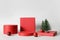 Xmas red stands with decorative Christmas tree. Podium background