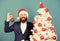 Xmas shop. merry christmas. bearded man santa hat hold xmas ball. magic creativity. white christmas. businessman