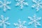 Xmas snowflake ornaments and decoration on blue background