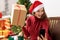 Xmas, winter, new year, Celebration, family concept - cute girl in Santa hat remotely wishes happy holiday