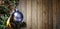 Xmass ball ornement tree against textured wooden wall