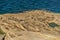 Xwejni Salt Pans and Xlendi Cliffs on Gozo island,Malta.Amazing natural creations originated from limestone.Traditional Sea-Salt