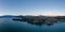 XXL panoramic evening sunset high angle aerial drone view of the town of Wanaka, a popular ski and summer resort town