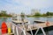 Yacht berthed at small offshore floating dock in cloudy winter a