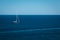 Yacht in the blue sea background, small sailboat adventure, seascape.