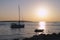 Yacht and boat on the sea in beautiful purplish sunset