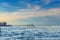 Yacht boats racing sailing on water of Venetian lagoon between wooden poles near Venice city