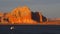 A yacht cruises through Lake Powell at Sunset