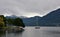 A yacht with lowered sails anchored on the Lake Maggiore or Verbano.