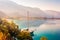 Yacht with lowered sails stands at the pier in early morning, Oludeniz, Turkey