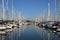 Yacht marina on a calm day with blue sky and reflective water