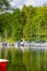 Yacht marina on the Masurian Lakes, yachts moored at the shore, reflection in the water, Ruciane-Nida, Poland