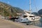 A yacht moored at the harbour at the Old Town of Kotor, at the bay of Kotor