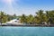 Yacht at a mooring among tropical palm trees