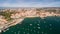 Yacht near beautiful beach and marina of Cascais Portugal aerial view