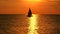 Yacht at orange sunset on the sea