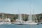 Yacht parking in harbor, harbor yacht club in Marina di Scarlino, Italy. Beautiful yachts on the background of the Italian coast