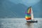 Yacht with rainbow sail in Geneva lake