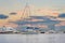 Yacht sailing against sunset. Holiday lifestyle landscape with skyline sailboat and sunset silhouette. Yachting tourism
