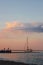 Yacht sailing against sunset. Holiday lifestyle landscape with skyline sailboat and two seagull. Yachting tourism -