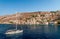 A yacht sailing in the gulf of Symi, Greece.