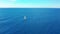 Yacht sailing on opened sea. Sailing boat. Yacht seen from drone. Yachting, aerial 4k.