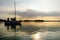 Yacht sailing towards sunset on Trakai lake